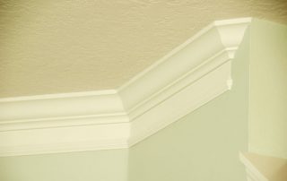 pale green room with white crown molding
