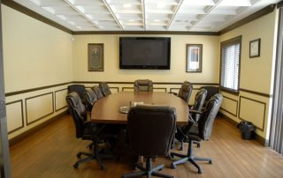 yellow conference room with table & chairs
